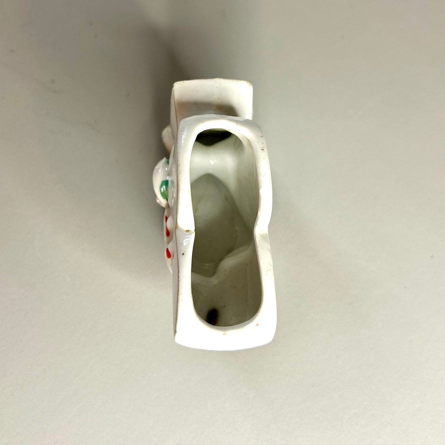 Hand holding club vase