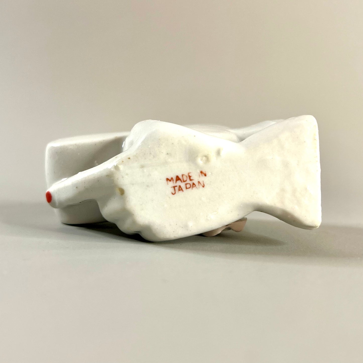 Hand holding club vase