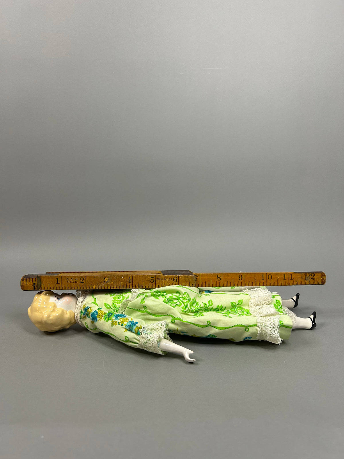 Blonde porcelain head doll