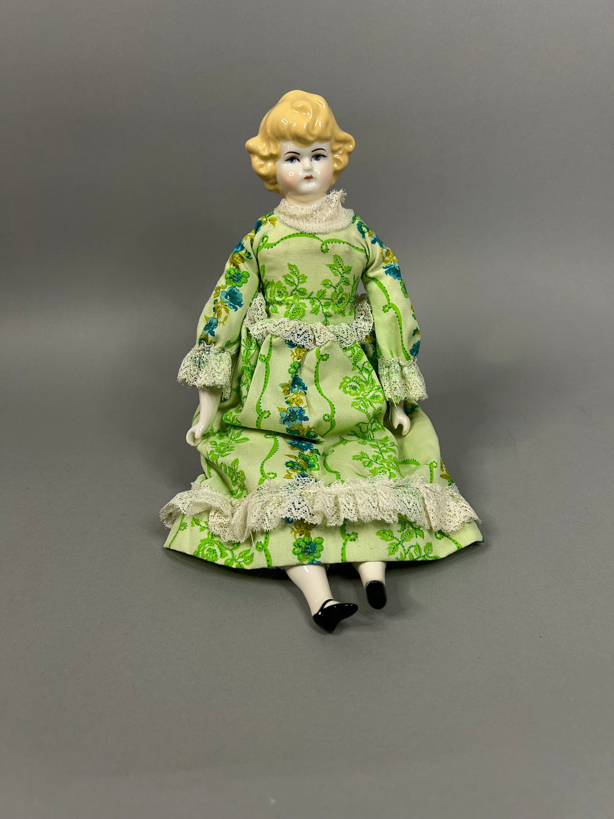 Blonde porcelain head doll