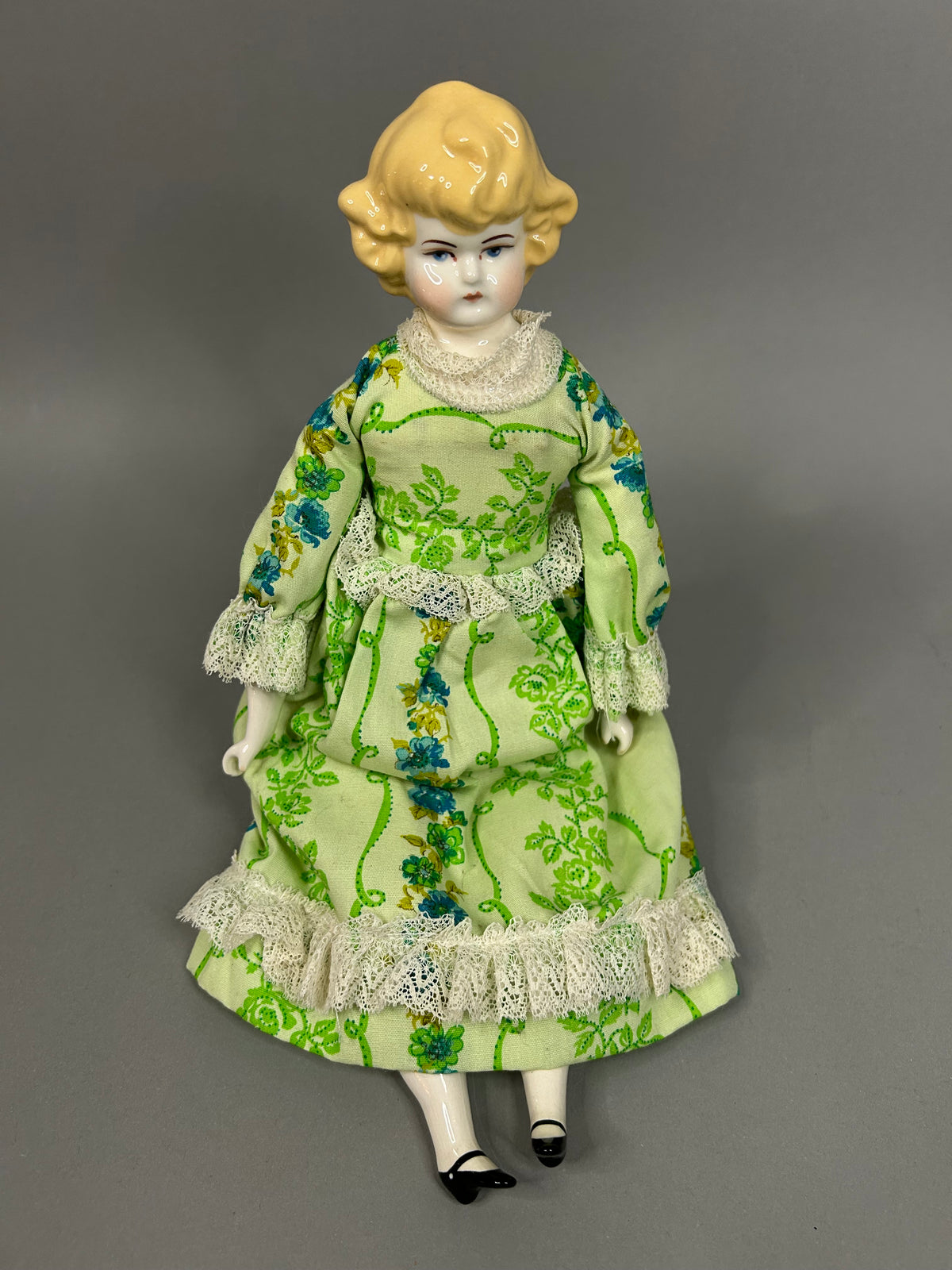 Blonde porcelain head doll